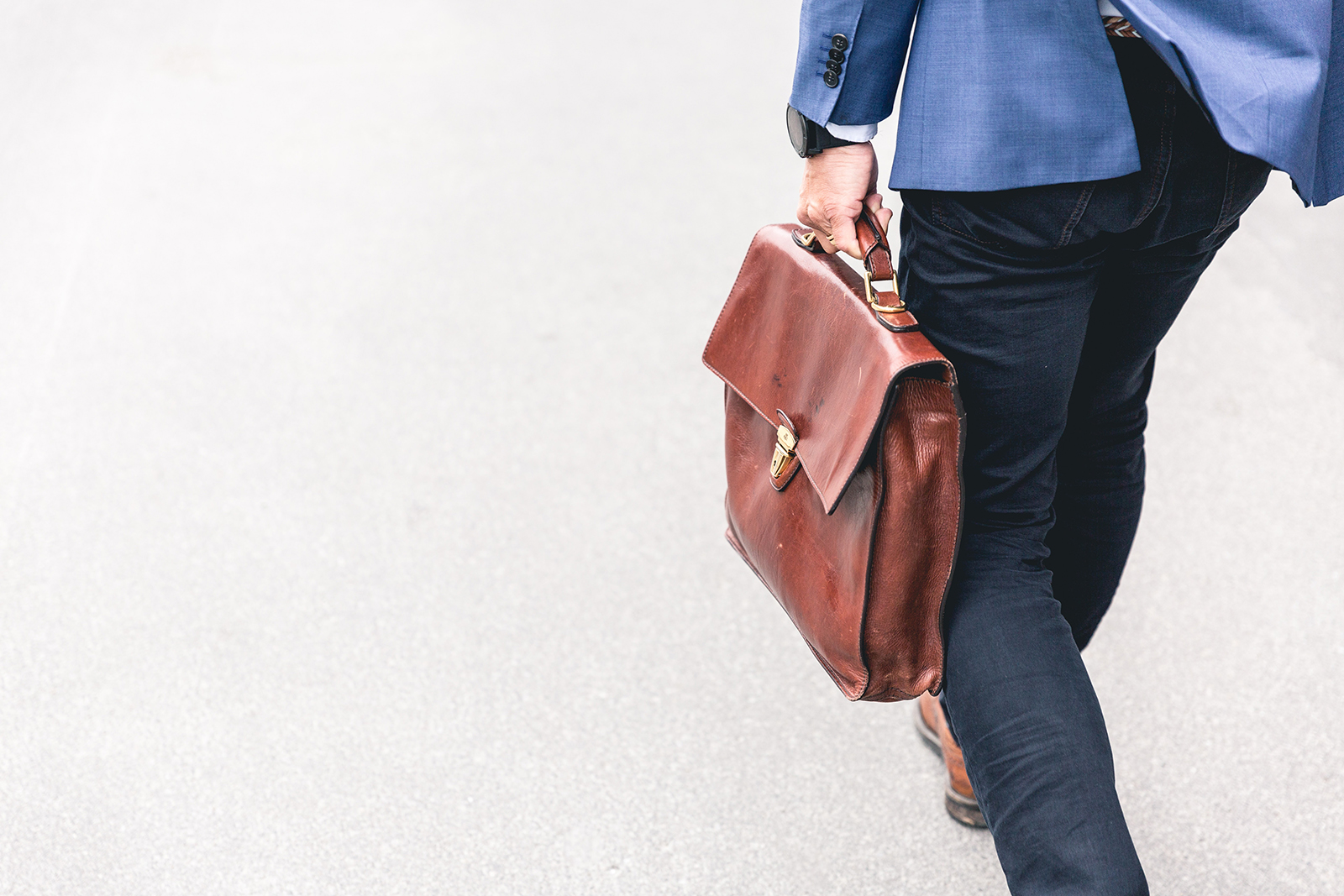 business man carrying briefcase