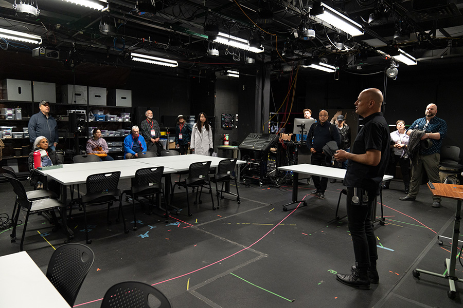 McKelvey speaks about the Media Lab and its primary residents, The Exploded Ensemble, while touring the basement with visitors.