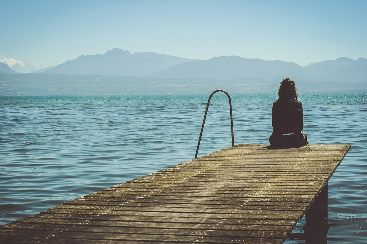 person sitting on the dock