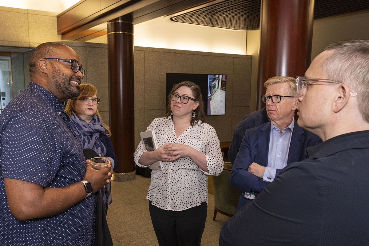 Derek Ham, the newly-named director of the Entertainment Technology Center (ETC), connects with Digitization Projects Manager and Data Deposit Coordinator Ann Marie Mesco, Associate Dean for Distinctive Collections Julia Corrin, Helen and Henry, Jr. Dean of the University Libraries Keith Webster, and Wittek.