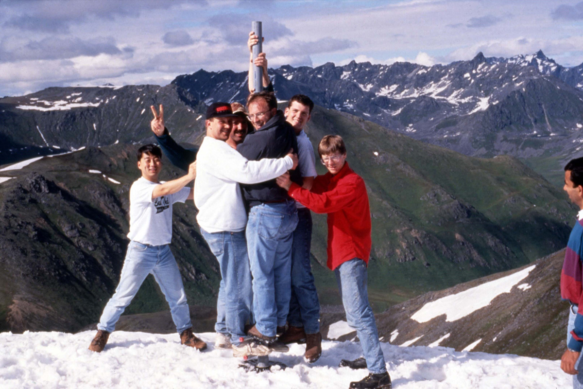 Members of the Dante II project team, including John Bares, Dimi Apostolopoulos, and Jay West, with one of the legs of Dante II during its expedition to Mt. Spurr, Alaska. From the Field Robotics Center Photographs.