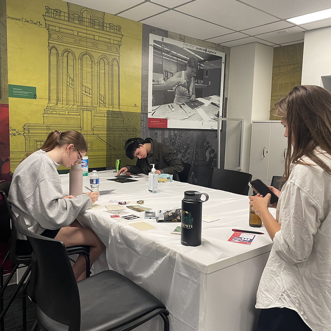 Students spread out across the Sustainability Studio in Hunt Library to create their postcards.