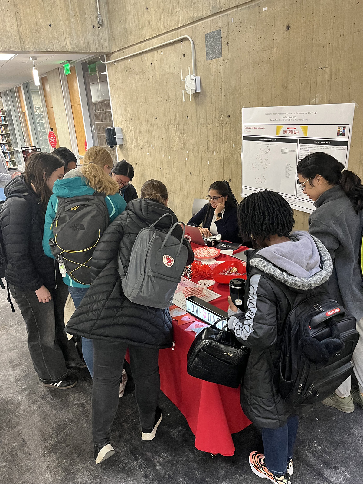 Arora engages with students stopping by the table to learn more about the Libraries’ data offerings.