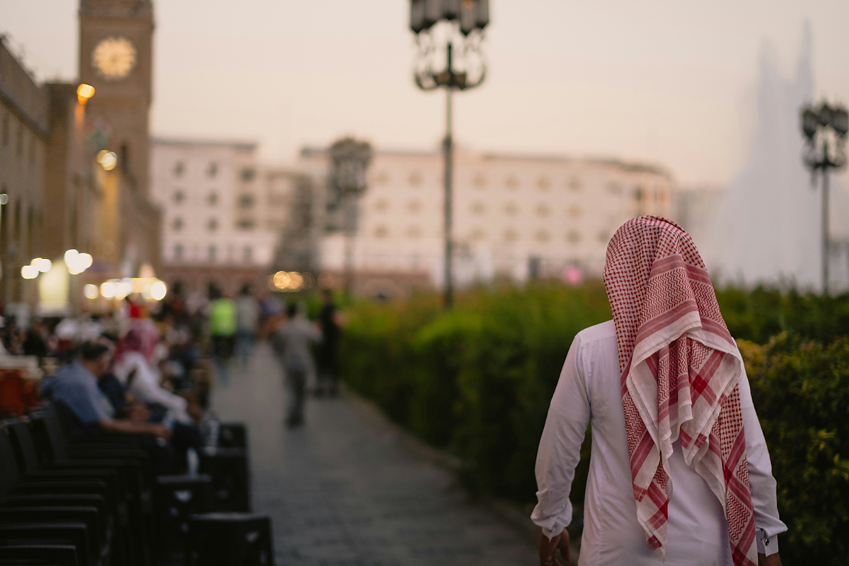 Arab person walking down the street