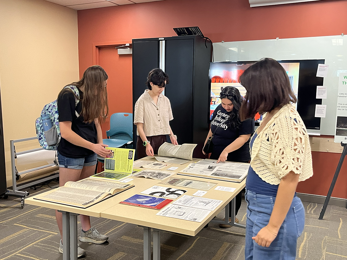 LSAC members Amanda Barajas, a first-year Bachelor of Humanities and Arts student, and Vivian Nam, a first-year art major in the College of Fine Arts, explore decades of materials tracing the history of WRCT, CMU’s freeform radio station that was founded in 1949.