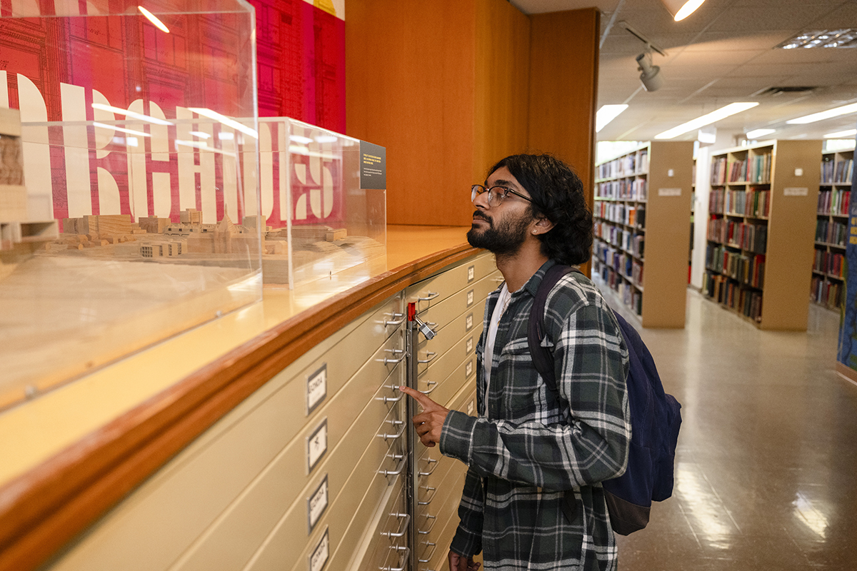 A student visits the Architecture Archives exhibit.