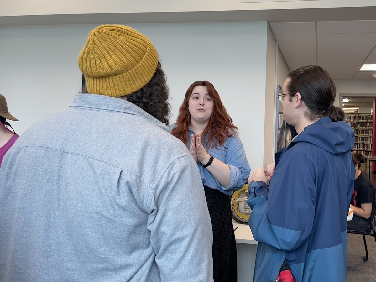 Robotics Project Interim Lead Archivist Kathleen Donahoe discusses the Robotics Project with alumni of the Robotics Club.