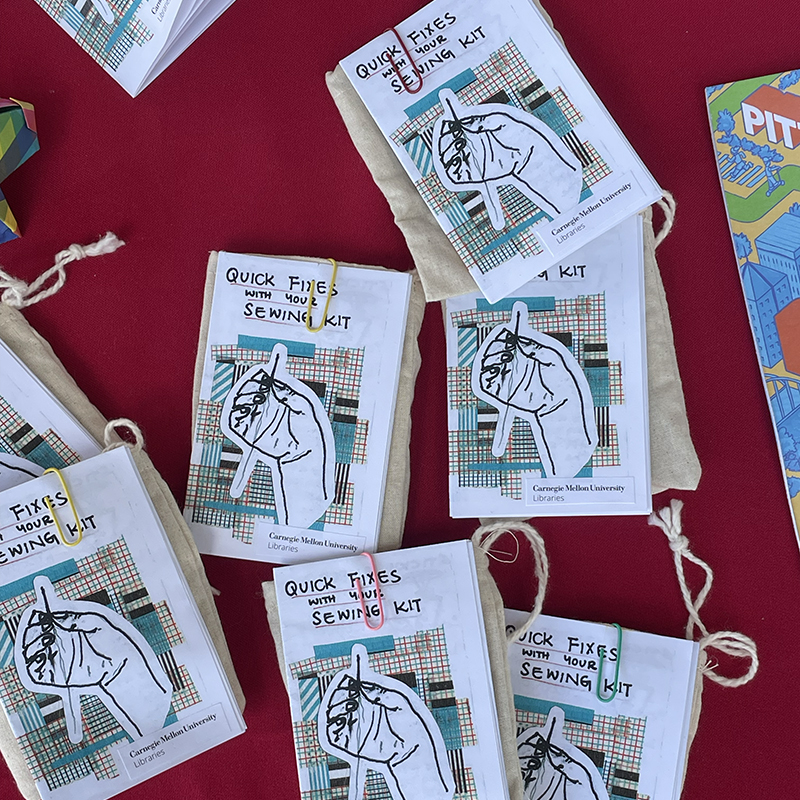 Libraries handed out mini sewing kits accompanied by instructional zines at the welcome table outside of Hunt.