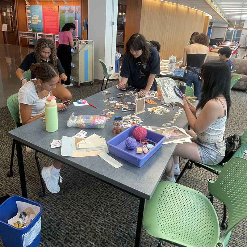Students on the fourth floor of Hunt Library used ephemera provided by Arts and Humanities Librarian Jill Chisnell to create their own garlands to decorate their dorm rooms.