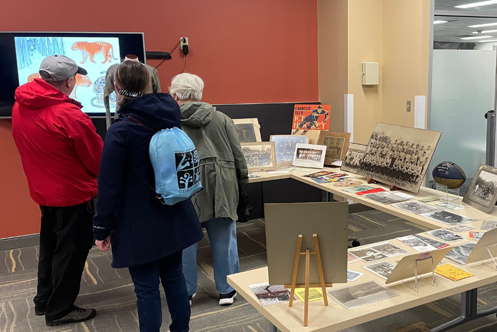 Alumni gravitated towards the sports archive to see photos, memorabilia, and programs from the past.