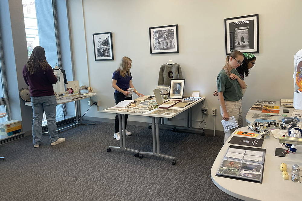 Visitors looked through t-shirts, photographs, flyers, and other CMU memorabilia in the Archives Reading Room on the second floor of Hunt Library.