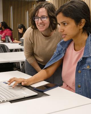 Sarah Young helps student