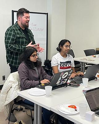Chasz Griego helping students